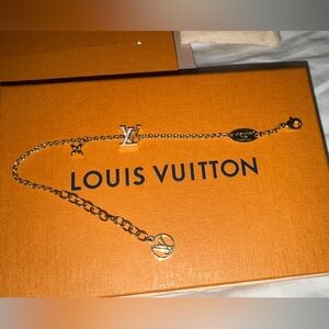 Louis Vuitton Gold-tone LV Charm Bracelet on Orange Box